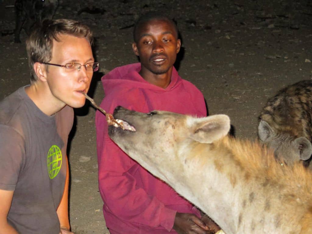 Feeding a wild Hyena with my mouth in Harar, Ethiopia.